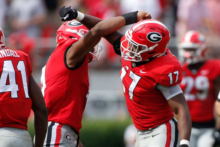 Georgia inside linebacker Nakobe Dean (17) celebrates with Georgia outside linebacker Nolan Smith (4) after getting a sack during the second half of an NCAA college football game between Arkansas and Georgia in Athens, Ga., on Saturday, Oct. 2, 2021. Georgia won 37-0. News Joshua L Jones Syndication Online Athens